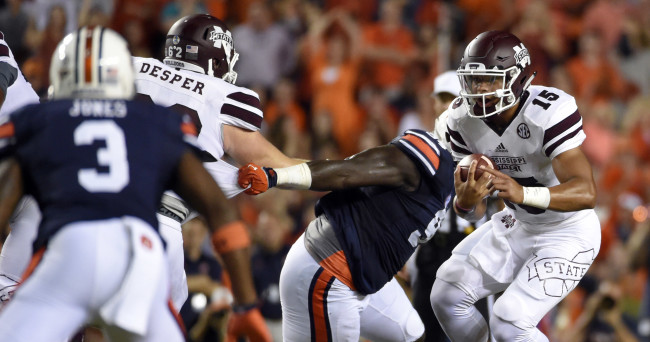 Sep 26, 2015; Auburn, AL, USA; Mississippi State Bulldogs quarterback Dak Prescott (15) scrambles for yardage against the Auburn Tigers during the first quarter at Jordan Hare Stadium. Mandatory Credit: John David Mercer-USA TODAY Sports